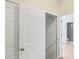 Hallway view featuring a closet and a partial view of a bathroom at 3045 Wyntree Dr, Peachtree Corners, GA 30071