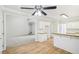 Open kitchen with breakfast bar and view into living room at 3045 Wyntree Dr, Peachtree Corners, GA 30071