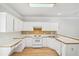 Kitchen with tile backsplash, white appliances and workspace at 3045 Wyntree Dr, Peachtree Corners, GA 30071