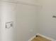 A laundry room with new paint, a storage shelf, and vinyl flooring at 3045 Wyntree Dr, Peachtree Corners, GA 30071