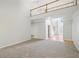 Spacious living area featuring a loft, large windows, and plush carpeting at 3045 Wyntree Dr, Peachtree Corners, GA 30071