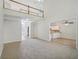 Open-concept living room featuring a loft, hardwood floors, and view into the kitchen at 3045 Wyntree Dr, Peachtree Corners, GA 30071