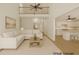 Bright living room featuring vaulted ceilings, an upper-level railing, and open access to the kitchen and other areas at 3045 Wyntree Dr, Peachtree Corners, GA 30071