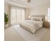 This staged main bedroom features a tray ceiling, neutral decor, and lots of natural light at 3045 Wyntree Dr, Peachtree Corners, GA 30071
