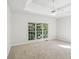 Light and airy main bedroom with carpeted floors, ceiling fan, and multiple windows at 3045 Wyntree Dr, Peachtree Corners, GA 30071