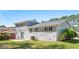 The back of the home is brick with a small patio and well manicured lawn at 4269 Indian Forest Trl, Stone Mountain, GA 30083