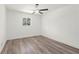Comfortable bedroom with modern ceiling fan, wood-look flooring, and plenty of natural light at 4269 Indian Forest Trl, Stone Mountain, GA 30083