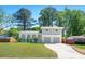 Charming two-story home featuring a beautiful brick facade, arched porch, second story balcony and well-maintained lawn at 4269 Indian Forest Trl, Stone Mountain, GA 30083