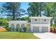 Charming two-story home featuring a beautiful brick facade, arched porch, second story balcony and well-maintained lawn at 4269 Indian Forest Trl, Stone Mountain, GA 30083