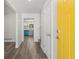 Inviting hallway with hardwood floors and a view of the modern kitchen through the doorway at 4269 Indian Forest Trl, Stone Mountain, GA 30083