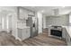 Modern kitchen featuring gray cabinetry, stainless steel appliances, and stylish backsplash at 4269 Indian Forest Trl, Stone Mountain, GA 30083