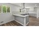 Modern kitchen with stainless steel appliances, gray cabinets, quartz counters, and hardwood floors at 4269 Indian Forest Trl, Stone Mountain, GA 30083