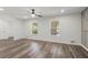 Bright living room featuring hardwood floors, modern lighting, and neutral walls at 4269 Indian Forest Trl, Stone Mountain, GA 30083