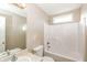 Well-lit bathroom with a shower-tub combination, toilet, and vanity with ample countertop space at 1501 Buckingham Pl, Stockbridge, GA 30281