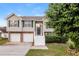 Charming split-level home with stone accents, attached two-car garage, and well-maintained landscaping at 1501 Buckingham Pl, Stockbridge, GA 30281