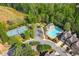 Aerial view of community amenities including pool, tennis court, and lush landscaping at 2872 Cross Creek Ct, Cumming, GA 30040