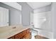 Bathroom showcasing vanity, tiled floors, and a shower-tub combination at 2872 Cross Creek Ct, Cumming, GA 30040