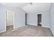 Spacious bedroom featuring vaulted ceiling, neutral paint, plush carpet, closet, and bathroom access at 2872 Cross Creek Ct, Cumming, GA 30040