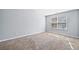 Bright bedroom with plush carpeting, neutral paint, and natural light from a window at 2872 Cross Creek Ct, Cumming, GA 30040