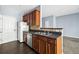 Kitchen with wooden cabinets, a stainless-steel dishwasher and sink, and laminate countertops at 2872 Cross Creek Ct, Cumming, GA 30040