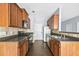 Functional kitchen featuring wood cabinets, laminate countertops, and essential appliances at 2872 Cross Creek Ct, Cumming, GA 30040