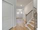 Inviting entryway with hardwood floors, white walls, and staircase to the upper level at 40 Begonia Ct, Covington, GA 30016