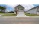 Charming two-story home with brick facade, a well-manicured lawn, and an attached two-car garage at 40 Begonia Ct, Covington, GA 30016