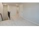 Second floor hallway with carpet flooring, and access to additional rooms, with views of the staircase at 40 Begonia Ct, Covington, GA 30016