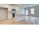 Modern open-concept kitchen with stainless steel appliances and an island at 40 Begonia Ct, Covington, GA 30016