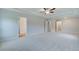 Spacious main bedroom featuring tray ceiling, ceiling fan, and ensuite bath and walk-in closet at 40 Begonia Ct, Covington, GA 30016