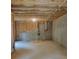 Unfinished basement with concrete walls, exposed ceiling, and stubbed plumbing for future development at 558 Fairview Oak Place, Dallas, GA 30157