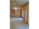 Spacious unfinished basement with framed walls, concrete floors, and an exterior door for easy access at 558 Fairview Oak Place, Dallas, GA 30157