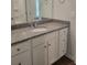 Bathroom vanity with modern hardware and a granite countertop at 558 Fairview Oak Place, Dallas, GA 30157