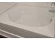 Modern bathtub with white tile surround and chrome fixtures at 558 Fairview Oak Place, Dallas, GA 30157
