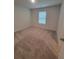 Bright bedroom with carpet and natural light from window at 558 Fairview Oak Place, Dallas, GA 30157