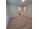 Bright bedroom with carpet and view to bathroom and other room at 558 Fairview Oak Place, Dallas, GA 30157