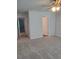 A spacious bedroom with neutral walls, carpet, and a ceiling fan with lights at 558 Fairview Oak Place, Dallas, GA 30157