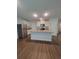Open kitchen featuring a granite island, stainless steel appliances, and hardwood flooring at 558 Fairview Oak Place, Dallas, GA 30157