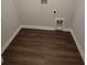A laundry room with dark laminate floors, white walls, and laundry hookups at 558 Fairview Oak Place, Dallas, GA 30157