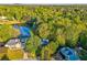 Stunning aerial view of property with a pond, mature trees, and inviting pool at 6 Sentry Rdg, Dallas, GA 30157