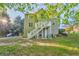 Expansive backyard with lush greenery, mature trees, and multi-level deck at 6 Sentry Rdg, Dallas, GA 30157