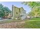Expansive backyard with lush greenery, mature trees, and multi-level deck at 6 Sentry Rdg, Dallas, GA 30157