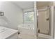 Bright bathroom features a bathtub, stand up shower, and modern fixtures creating a luxurious spa-like experience at 6 Sentry Rdg, Dallas, GA 30157