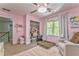 Bright, stylish bedroom featuring neutral tones, a window view, and closet for storage at 6 Sentry Rdg, Dallas, GA 30157