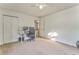 Bright bedroom featuring neutral carpet, closet and home office set up at 6 Sentry Rdg, Dallas, GA 30157