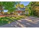 Classic two-story home with a spacious front porch and a long driveway at 6 Sentry Rdg, Dallas, GA 30157