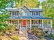 Inviting two-story home with a covered front porch and a lovely green lawn at 6 Sentry Rdg, Dallas, GA 30157