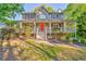 Charming two-story home with a inviting front porch and a bright red door at 6 Sentry Rdg, Dallas, GA 30157