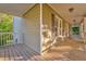 Spacious covered front porch showcasing beautiful wood floors and detailed columns at 6 Sentry Rdg, Dallas, GA 30157