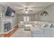 Spacious living room features a fireplace, large sectional sofa, and modern television for comfortable living at 6 Sentry Rdg, Dallas, GA 30157
